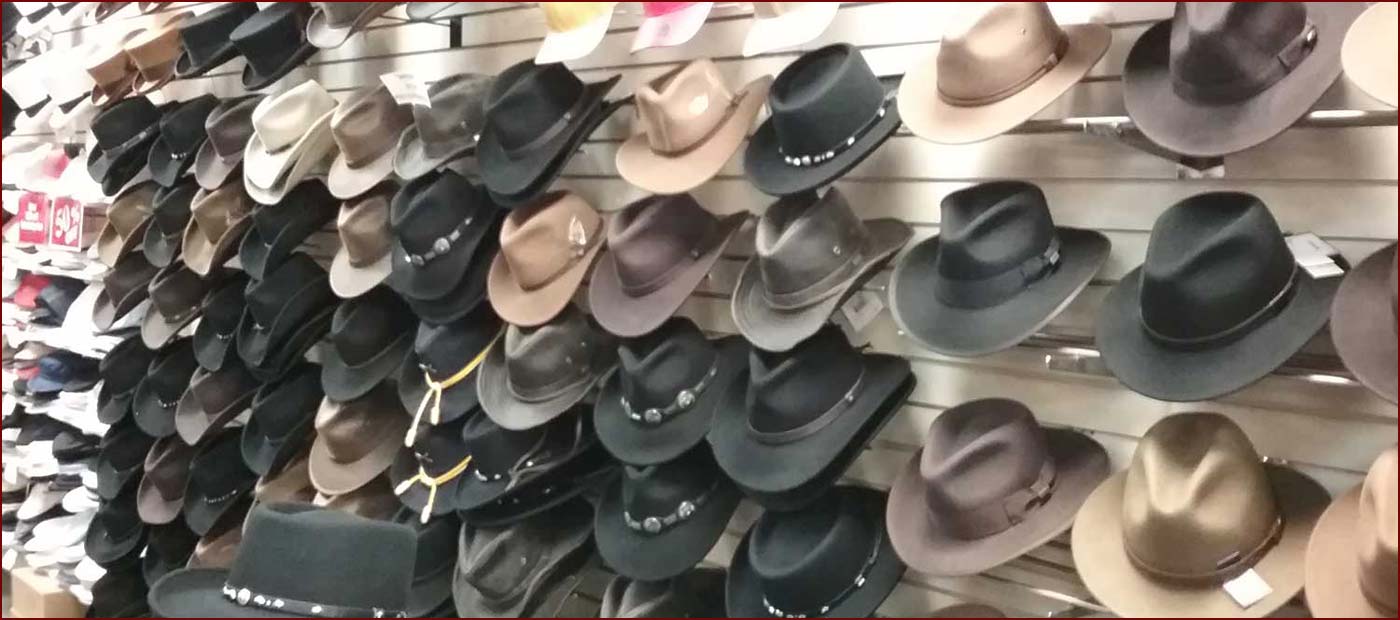 Wall of men's cowboy & Aussie hats